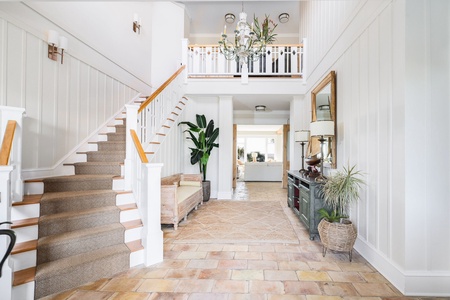 Step into your bright, open foyer with a grand staircase