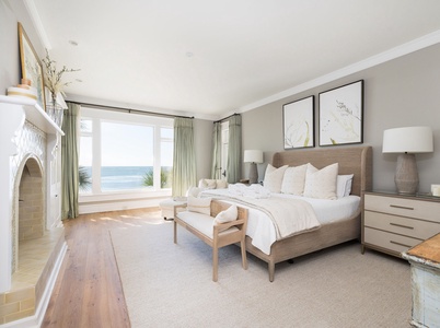 The main level primary king bedroom has incredible views and a decorative fireplace