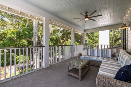 A large outdoor fan keeps you cool on your second floor deck