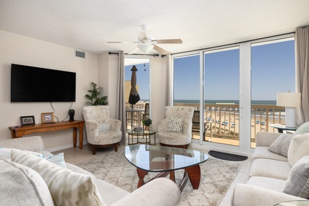 Your living room features oversized windows with views of Folly Beach