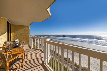Sip your morning coffee from this stunning oceanfront balcony, where endless beach views and gentle waves create your perfect coastal retreat.
