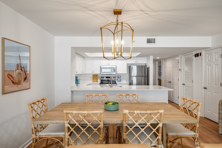 Gather around your beautiful dining table for meals and memories in this bright, open-concept space with modern kitchen.