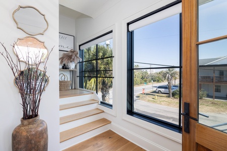 Warm wooden steps take you to your second floor