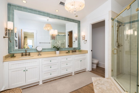 The queen en suite has dual vanities and walk-in shower