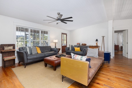 Living space offers extra seating and natural light — perfect for conversation, games, or quiet reading.