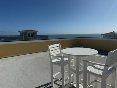 Soak up the ocean breeze on your private rooftop terrace, where stunning sea views meet endless blue skies for perfect morning coffee moments.