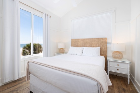 The first upstairs queen bedroom offers oceanside views