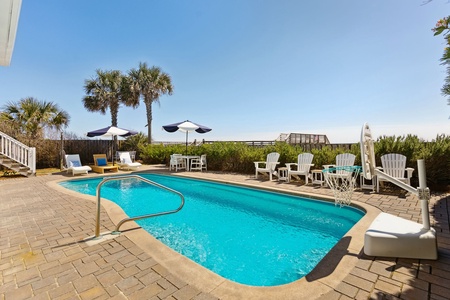 Ocean-View Pool Area – Relax at Sunshine by the Sea with plenty of seating and endless views.