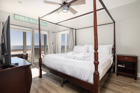 Wake up to stunning ocean views from your elegant four-poster bed, where coastal breezes drift through French doors to your private balcony.