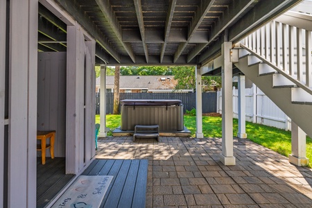 Unwind in your private hot tub on the covered downstairs patio