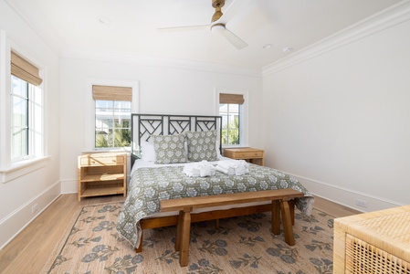 Drift off peacefully in your airy bedroom with crisp linens and warm coastal light streaming through bamboo blinds.