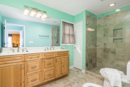 Your full en suite bathroom has a walk-in shower and dual vanity