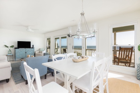 Coastal-style dining room with seating for the whole group, perfect for shared meals with an ocean backdrop