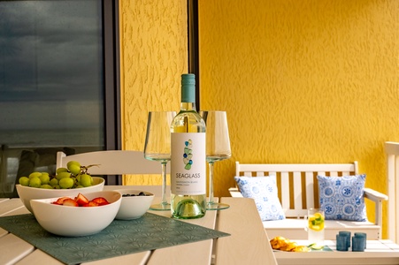 Savor fresh fruit and wine on your private terrace, where warm yellow walls create the perfect backdrop for memorable evenings.