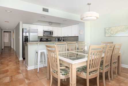 Your bright, open kitchen and dining area features modern appliances and seating for eight, perfect for family meals together.
