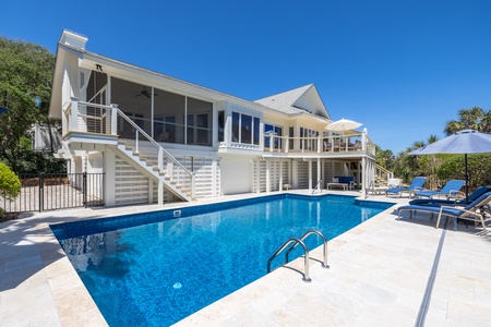 Welcome to No More Cloudy Days, a stunning oceanfront getaway with a sparkling private pool and direct beach access