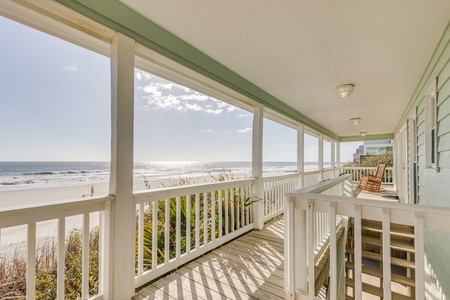 Relax on the covered porch with panoramic water views and salty breezes all day long