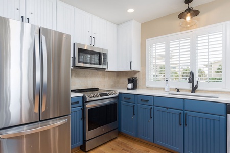 Your fully-equipped kitchen features an electric stove, fridge, microwave and dishwasher.