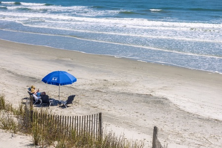 Pristine beach setting with gentle waves and soft sand, perfect for peaceful coastal getaways.