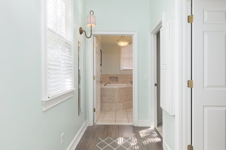 Pass through the hallway to your upstairs primary bathroom