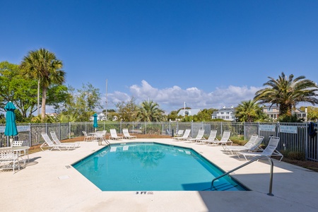 Your on-site swimming pool features comfortable loungers and tropical views