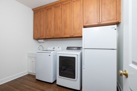 Your convenience suite includes a full-size washer and dryer with abundant cabinet storage, perfect for longer stays when you need the comforts of home.