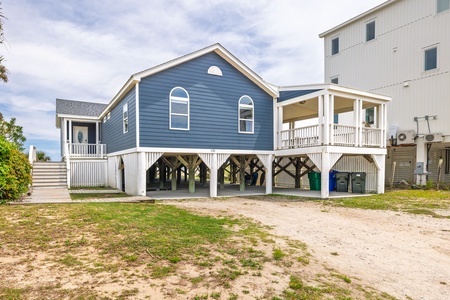 A gravel driveway offers private parking