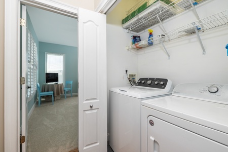 Your laundry closet sits just off your queen bedroom