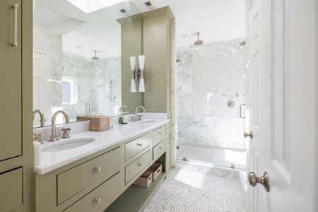 The primary third floor en suite bathroom features a spa-like shower