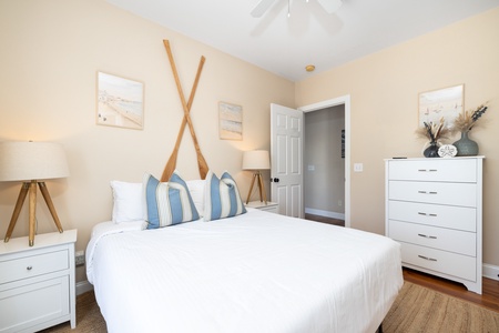 Your first queen bedroom is nautically themed