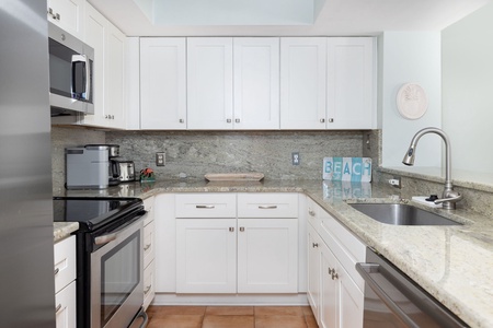 Your fully equipped kitchen invites culinary adventures with granite countertops, stainless steel appliances, and all the essentials for memorable meals.