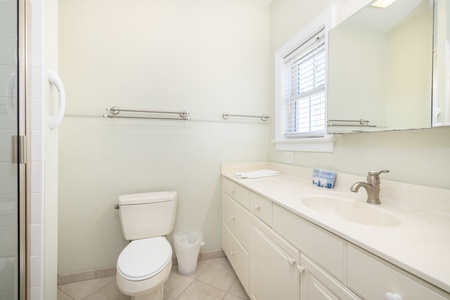 Your first king en suite bathroom features a walk in shower and large vanity