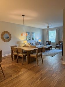 Unwind in your open-plan living space with cozy dining for six and plush seating perfect for evening conversations.