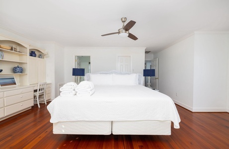 Spacious upstairs primary bedroom with a king bed and a bright, airy feel
