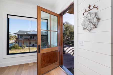 Step through your modern front door into a bright, naturally lit foyer