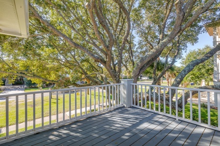 Relax under the trees on your upstairs deck