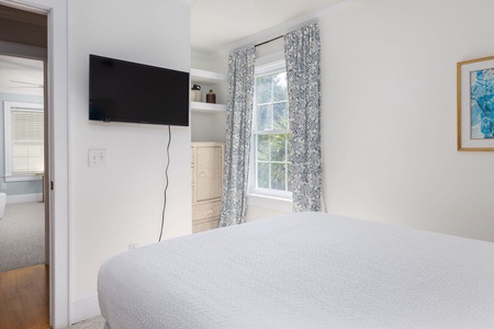 Queen bedroom has a TV