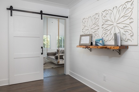Steps from your front door is the sliding door to the sunroom