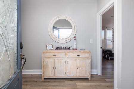 Step into your welcoming entryway where coastal charm meets comfort, complete with thoughtful touches that make you feel instantly at home.