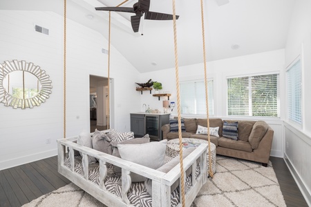 Enjoy the cozy rope swing in your bright and airy sunroom