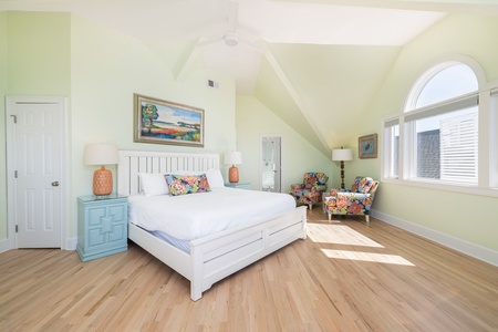 Your large primary bedroom on the third floor has space for sitting and a private balcony