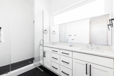 Your queen bedroom en suite has a large walk-in shower and dual vanity