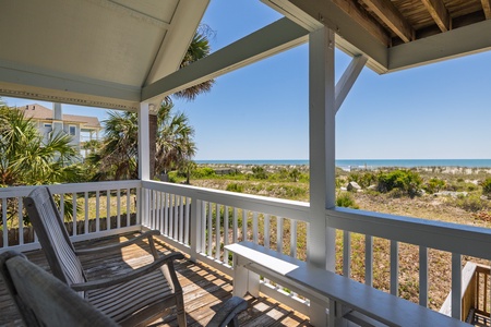 Unwind on your covered balcony and take in the sights and sounds of Folly Beach