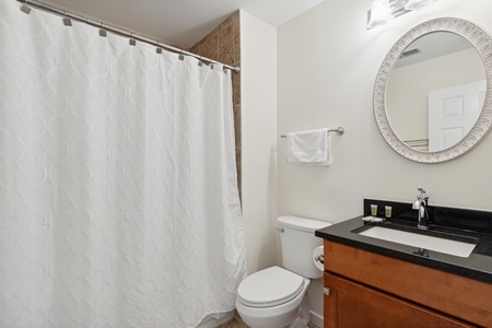 The upstairs full bathroom features a tub-shower combo