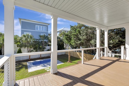 Relax on your private deck with pool views and tropical surroundings, perfect for morning coffee or sunset drinks.