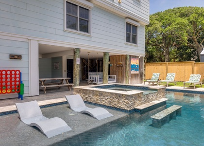 Loungers and a sparkling pool create the ultimate spot to unwind.