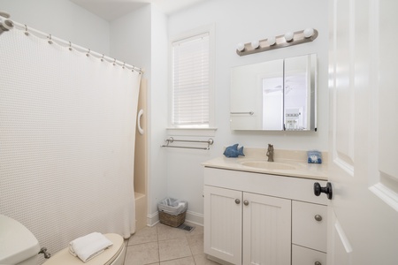 The second en suite bathroom offers a tub-shower combo
