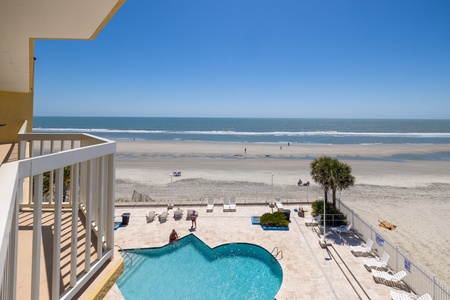 View the on-site pool from your private terrace