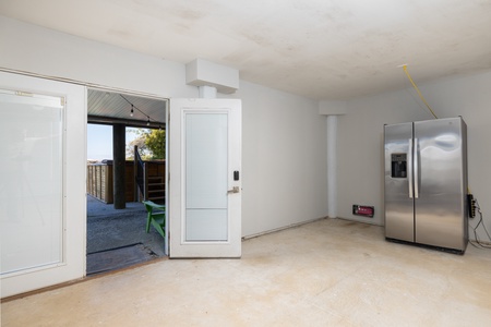 Your first floor features a second refrigerator and access to your back patio