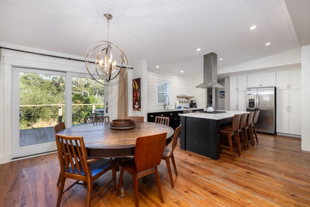 An open floor plan leads you from the living area to the dining room and kitchen